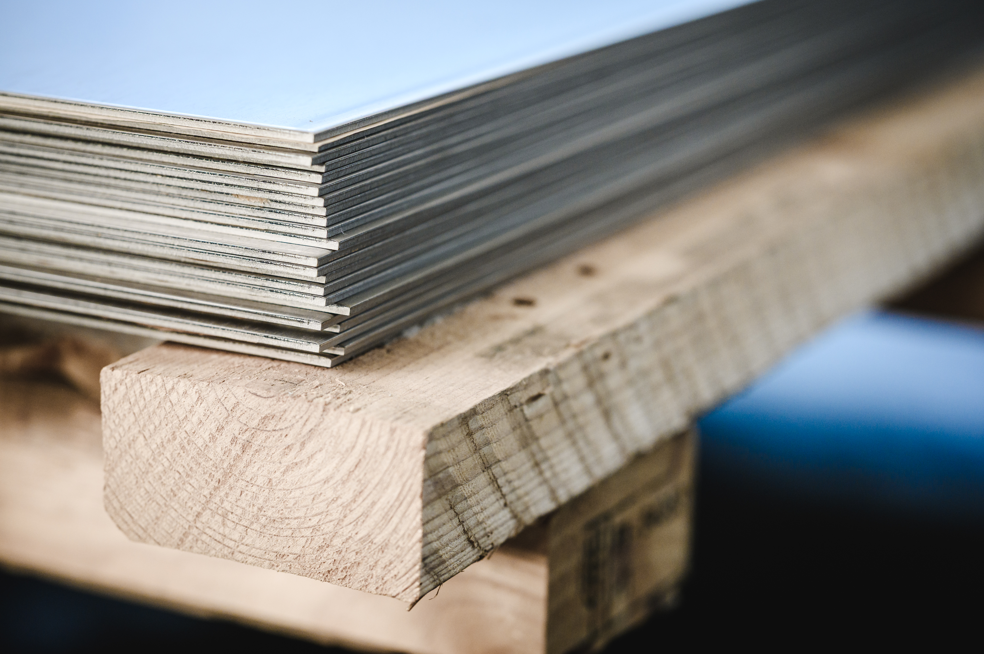 Stacked sheet metal in stock at Tennant Metall